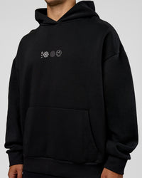 Man wearing Trust The Process Unisex Oversized Hoodie - Black-White | Model:Jaiden | Size:L