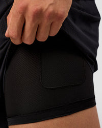 Man wearing UltraAir 5" Lined Performance Short  - Black-Reflective | Model:Liam | Size:L