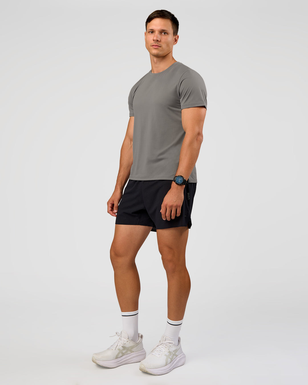 Man wearing UltraAir 5" Lined Performance Short  - Black-Reflective | Model:Liam | Size:L