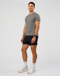 Man wearing UltraAir 5" Lined Performance Short  - Black-Reflective | Model:Liam | Size:L