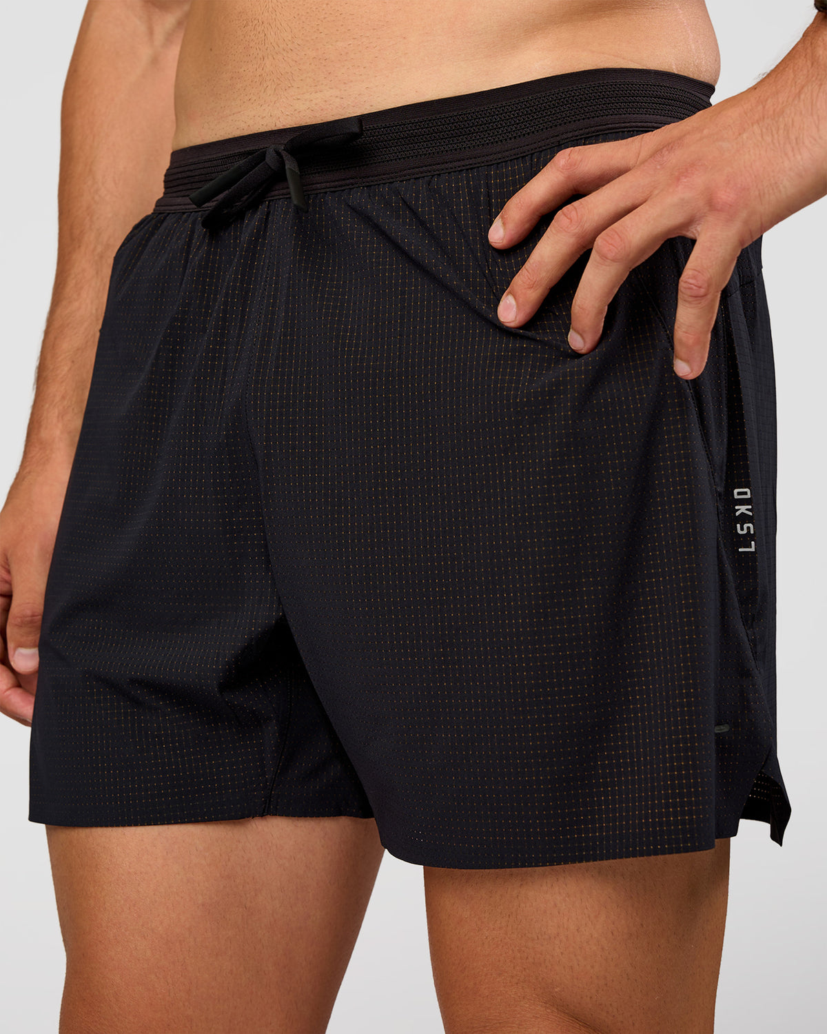 Man wearing UltraAir 5" Lined Performance Short  - Black-Reflective | Model:Liam | Size:L