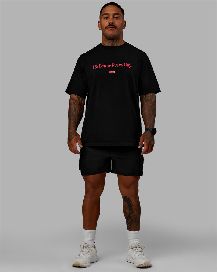 Man wearing Unisex 1% Better FLXCotton Tee Oversize - Black-Scarlet