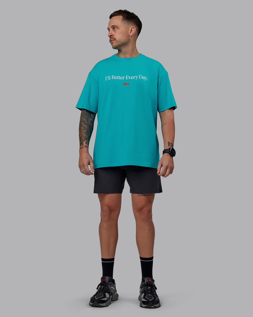 Man wearing Unisex 1% Better FLXCotton Tee Oversize - Blue Bird-White