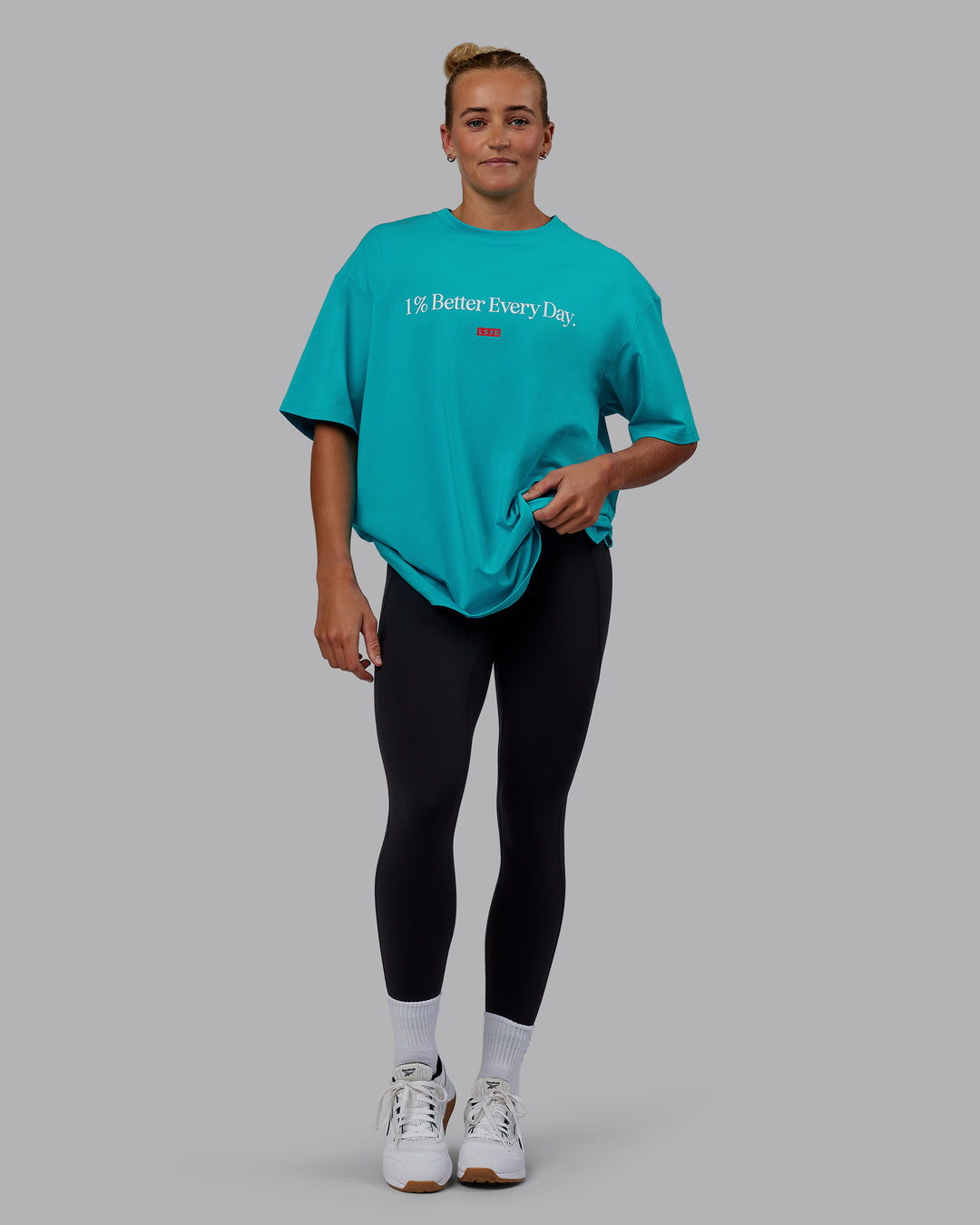 Woman wearing Unisex 1% Better FLXCotton Tee Oversize - Blue Bird-White