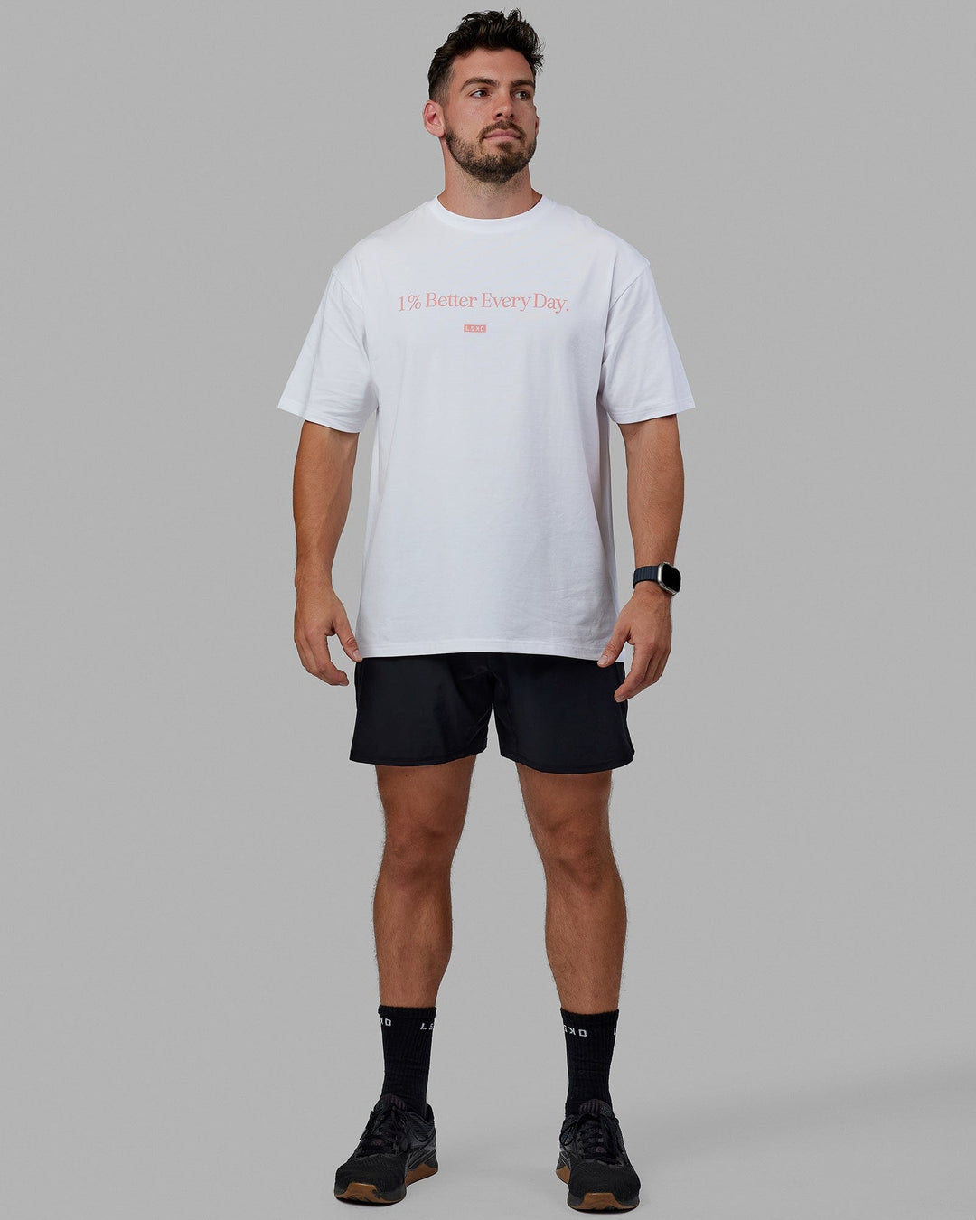 Man wearing Unisex 1% Better FLXCotton Tee Oversize - White-Coral