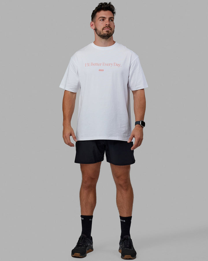 Man wearing Unisex 1% Better FLXCotton Tee Oversize - White-Coral