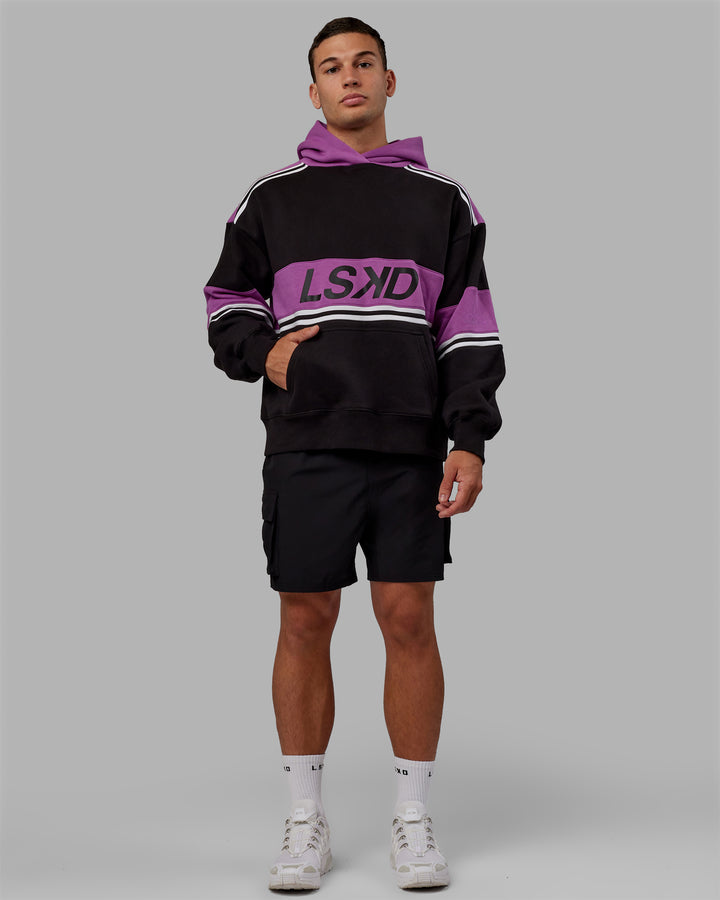Man wearing Unisex A-Team Hoodie Oversize - Black-Hyper Violet