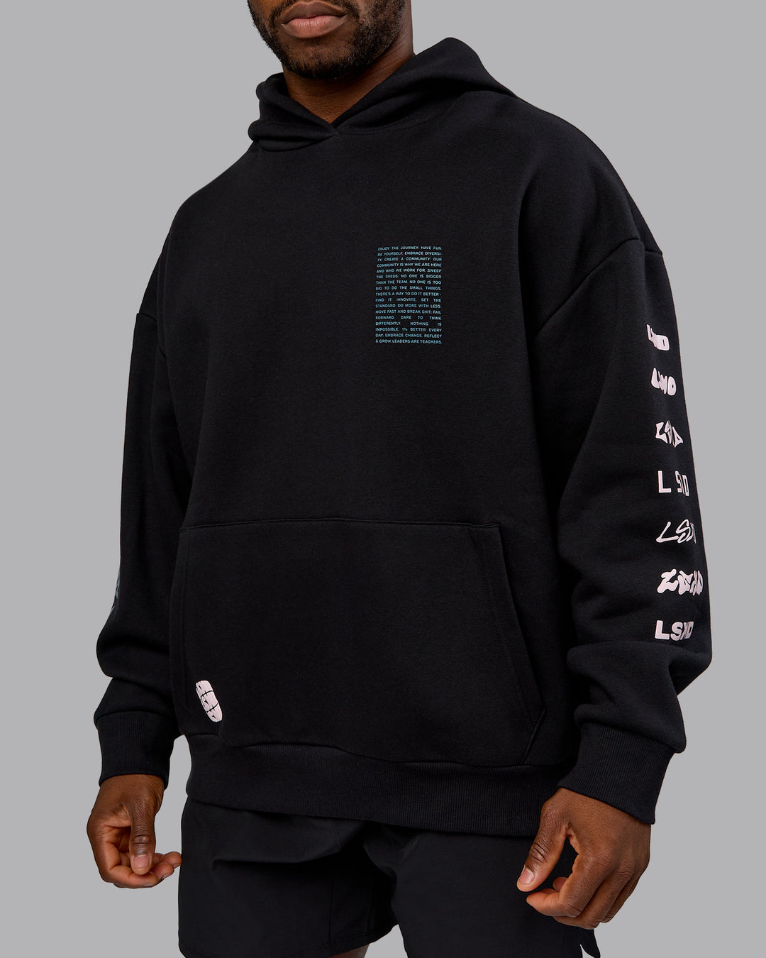 Man wearing Displacement Oversized Hoodie - Black-Blue Coral | Model:Sam | Size:L