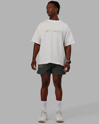 Man wearing Unisex Enjoy The Journey Heavyweight Tee Oversize - Off White-Multi
