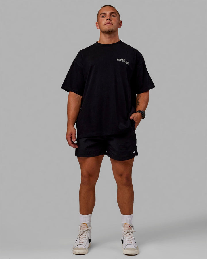 Man wearing Unisex Fitness Club Heavyweight Tee Oversize - Black-Off White