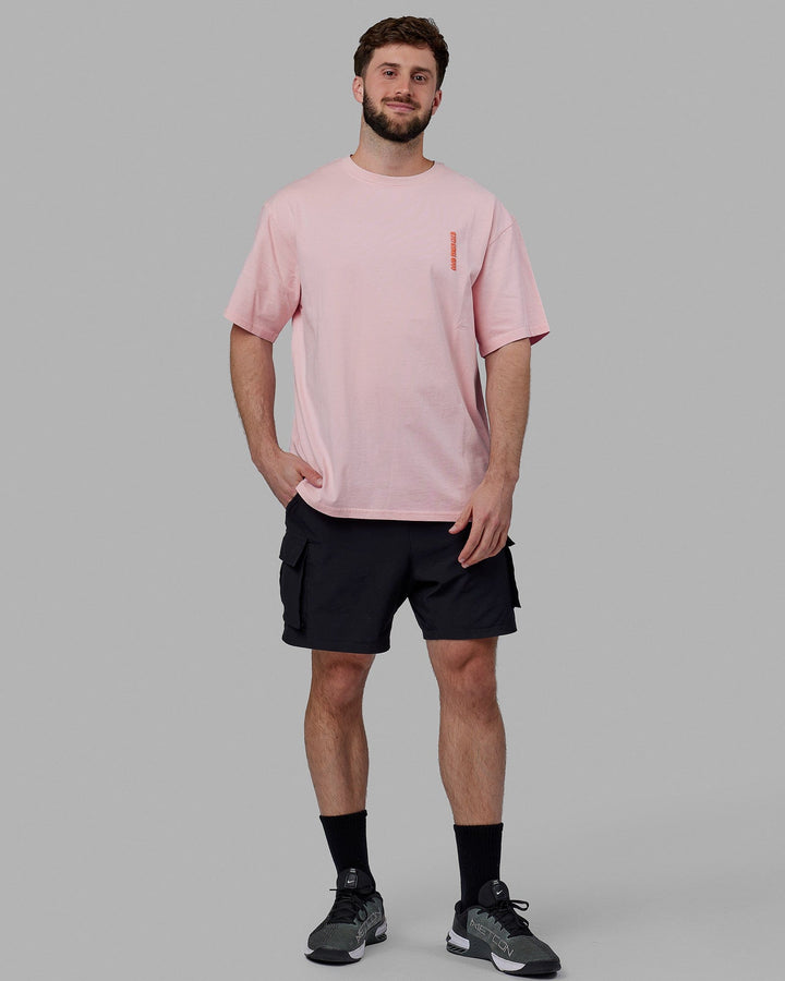Man wearing Unisex Good Times Global Heavyweight Tee Oversize - Marshmallow-Pink-Red