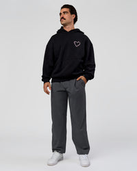 Man wearing Unisex Love The Process Oversize Hoodie - Black-Marshmallow | Model:Adam | Size:L