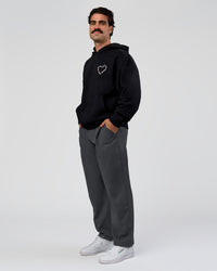Man wearing Unisex Love The Process Oversize Hoodie - Black-Marshmallow | Model:Adam | Size:L