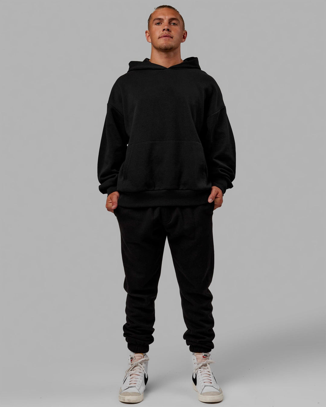 Man wearing Unisex Love The Run Hoodie Oversize - Black-White