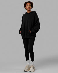 Woman wearing Unisex Love The Run Hoodie Oversize - Black-White