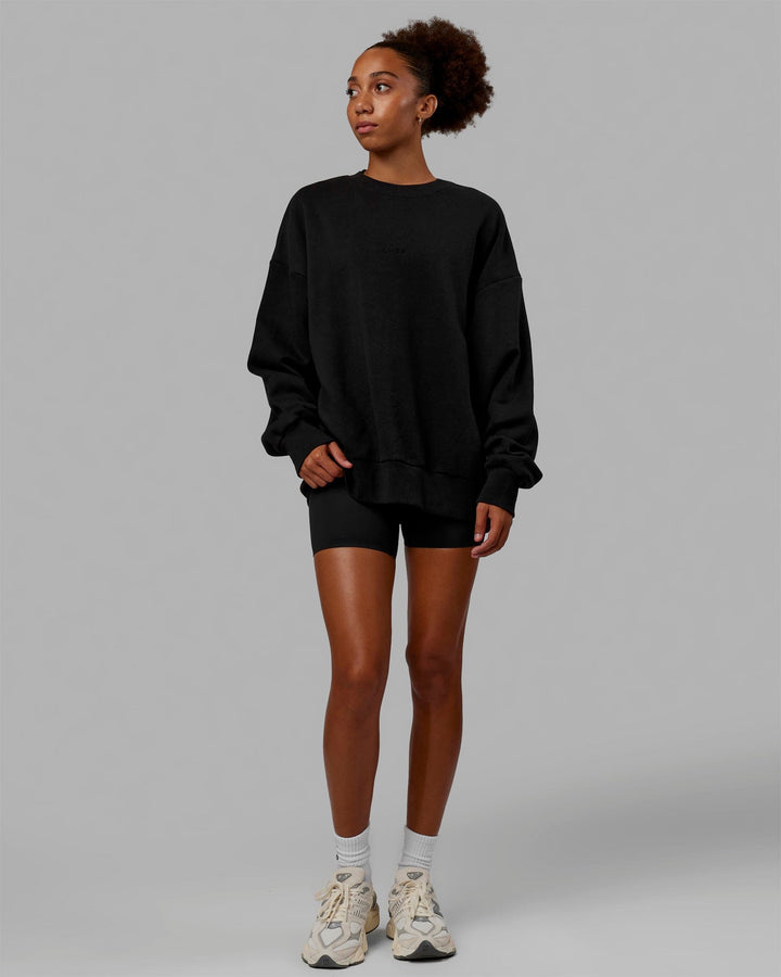 Woman wearing Unisex MVP Sweater Oversize - Black