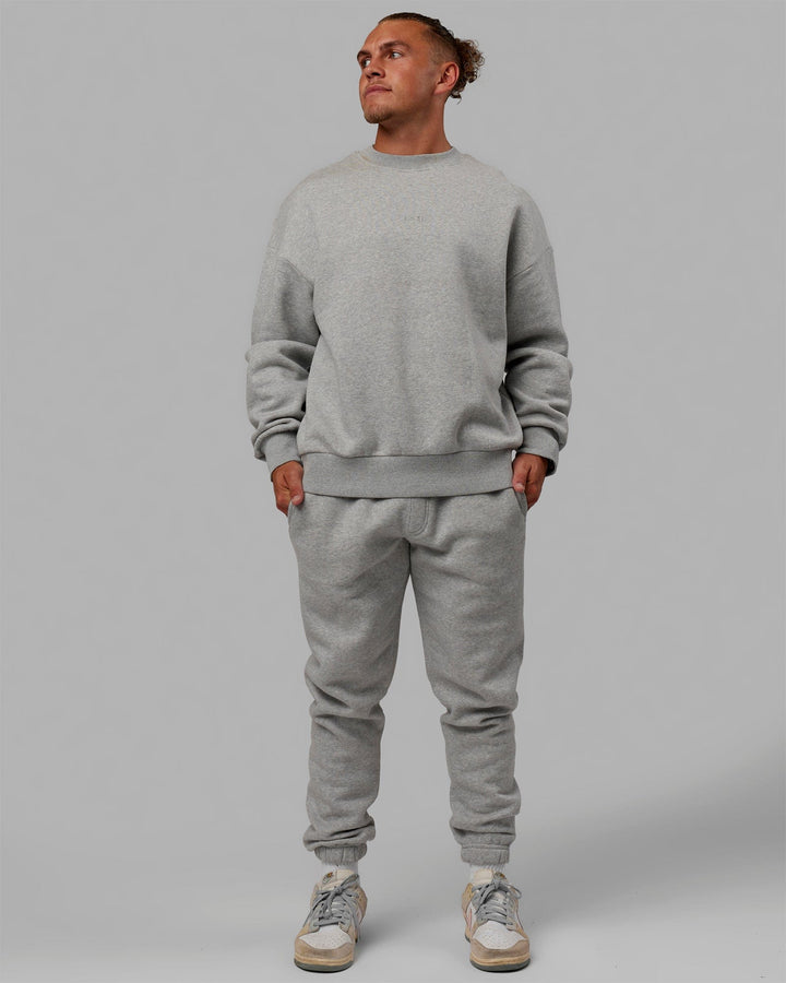 Man wearing Unisex MVP Sweater Oversize - Lt Grey Marl