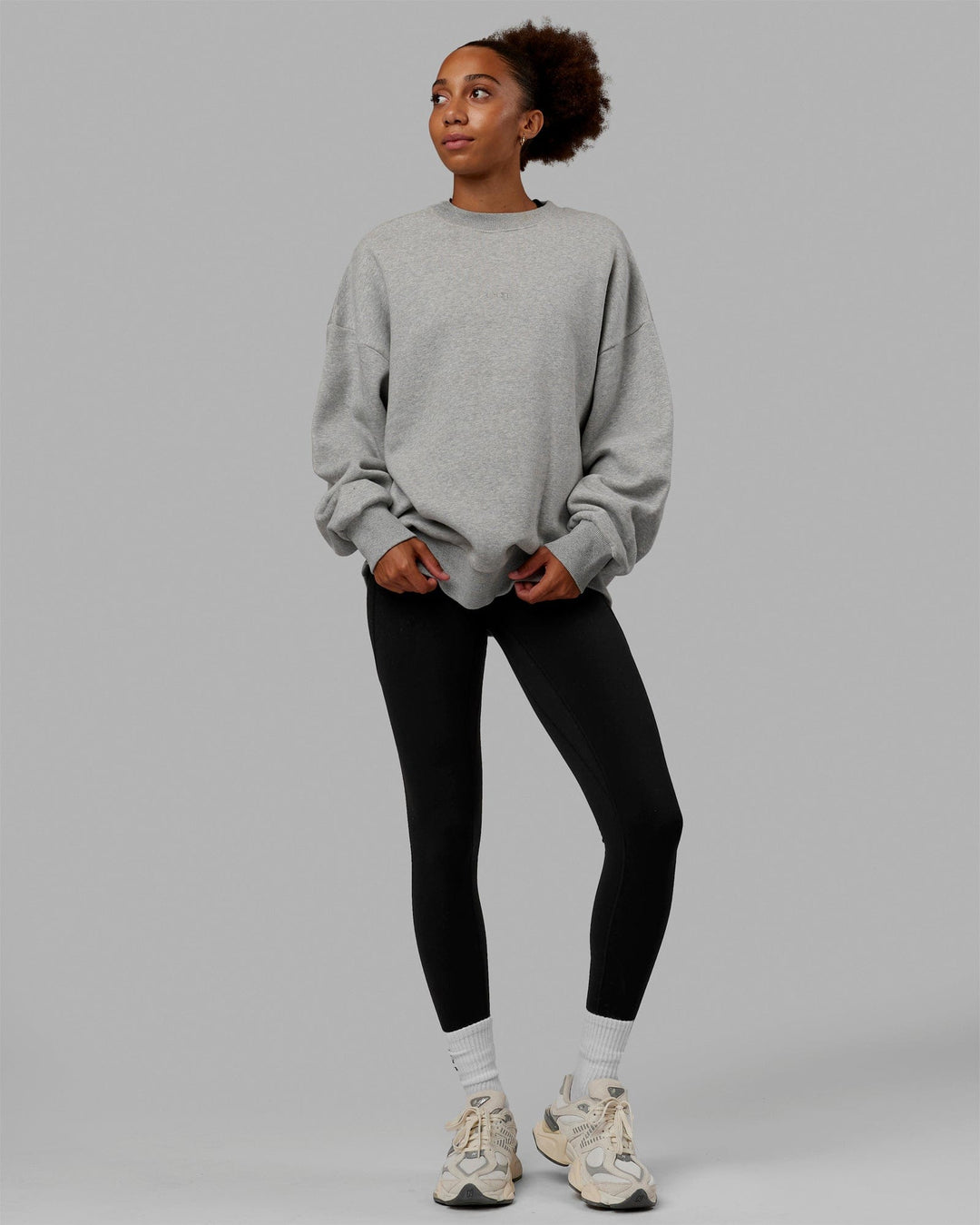 Woman wearing Unisex MVP Sweater Oversize - Lt Grey Marl