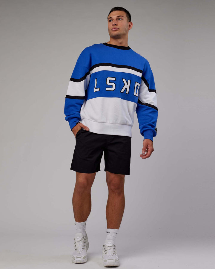 Man wearing Unisex PrimeTime Sweater Oversize - Power Cobalt-White
