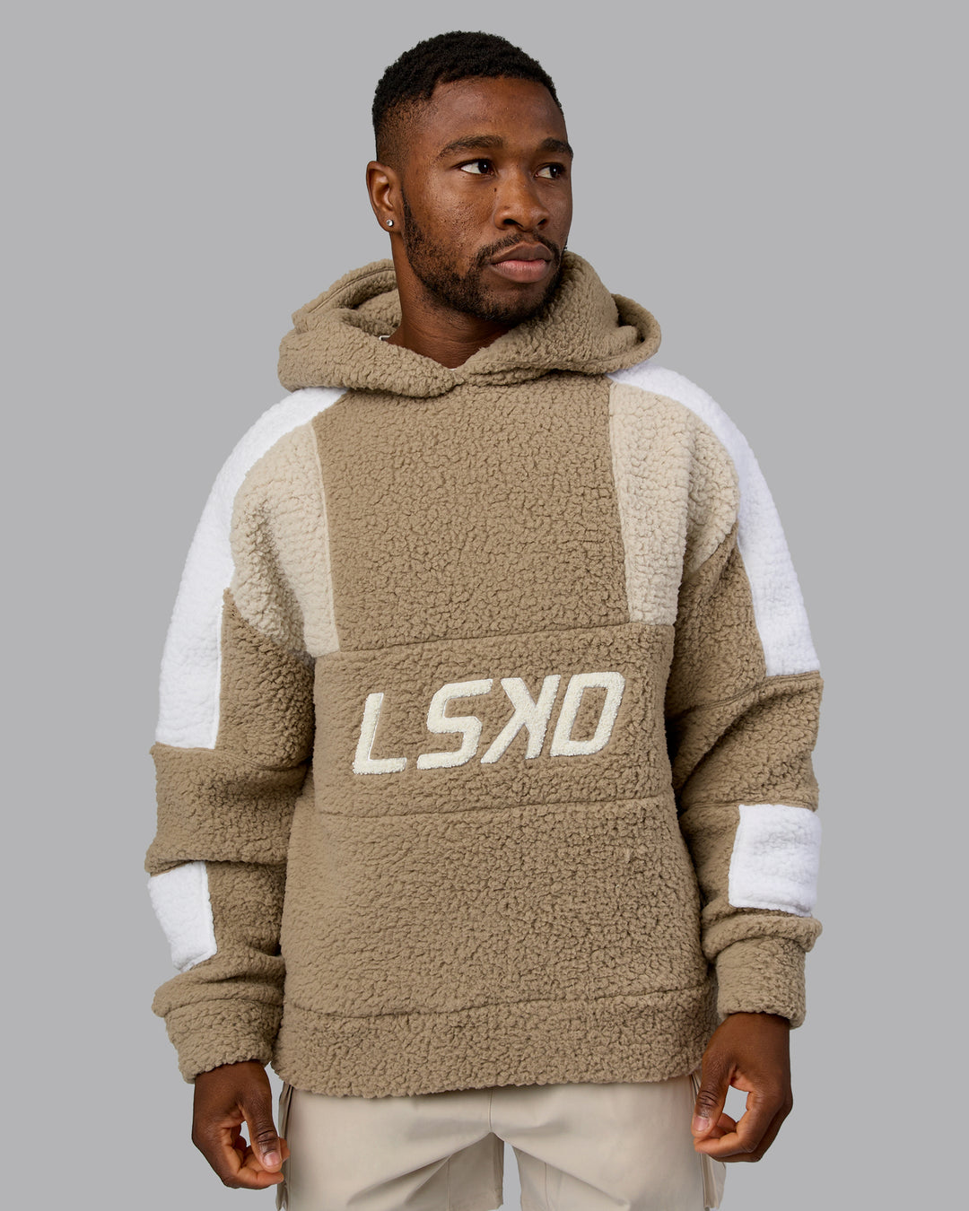 Man wearing Sherpa Slam Hoodie Oversized - Greige-Shale Beige-White | Model:Sam | Size:L
