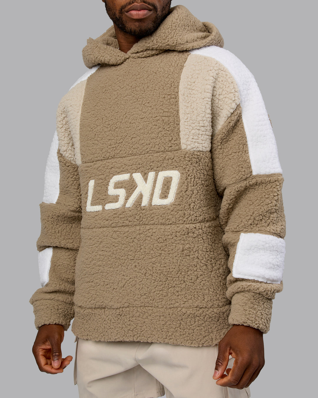 Man wearing Sherpa Slam Hoodie Oversized - Greige-Shale Beige-White | Model:Sam | Size:L