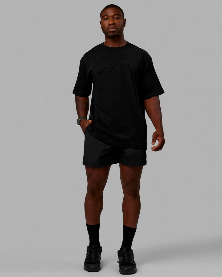 Man wearing Unisex Stamped 2.0 Heavyweight Tee Oversize - Black