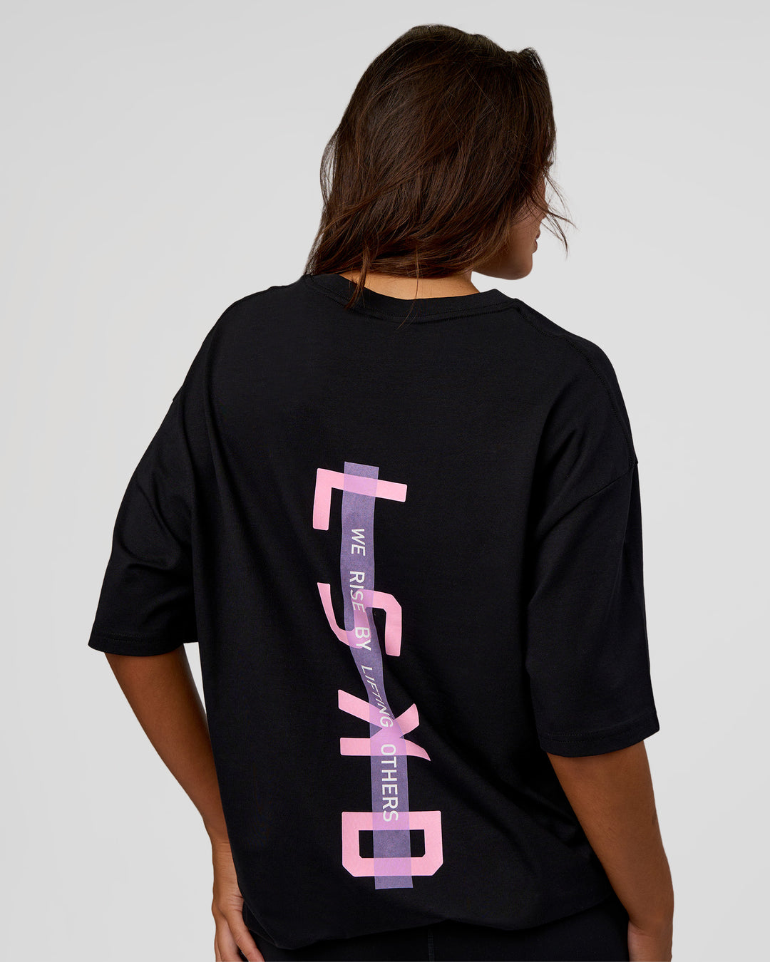 Woman wearing Unisex Strike Through FLXCotton Tee Oversize - Black-Candy Pink | Model:Kirstyn | Size:L