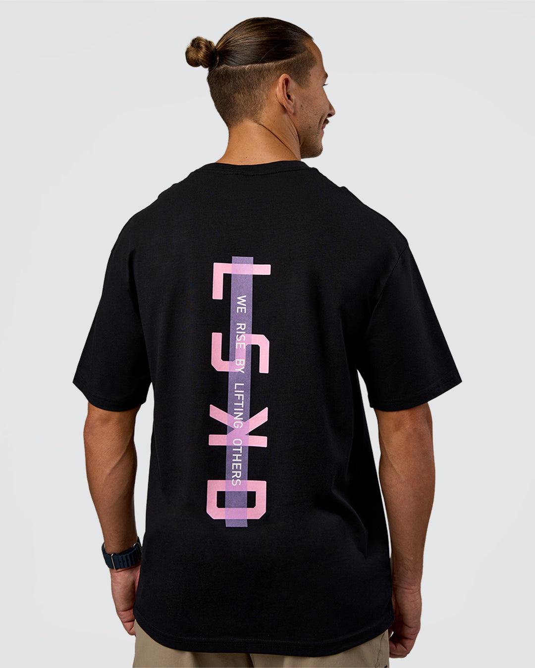 Man wearing Unisex Strike Through FLXCotton Tee Oversize - Black-Candy Pink | Model:Jaiden | Size:L
