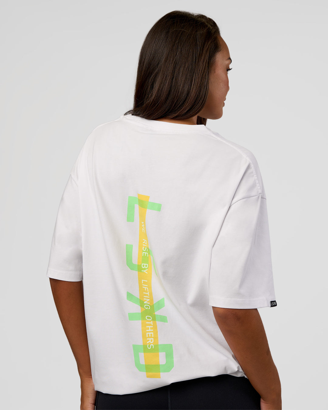 Woman wearing Unisex Strike Through FLXCotton Tee Oversize - White-Warm Apricot | Model:Kirstyn | Size:L