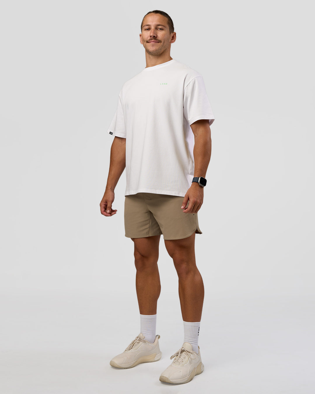 Man wearing Unisex Strike Through FLXCotton Tee Oversize - White-Warm Apricot | Model:Jaiden | Size:L