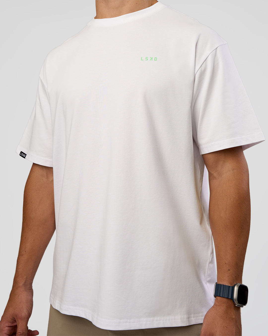 Man wearing Unisex Strike Through FLXCotton Tee Oversize - White-Warm Apricot | Model:Jaiden | Size:L