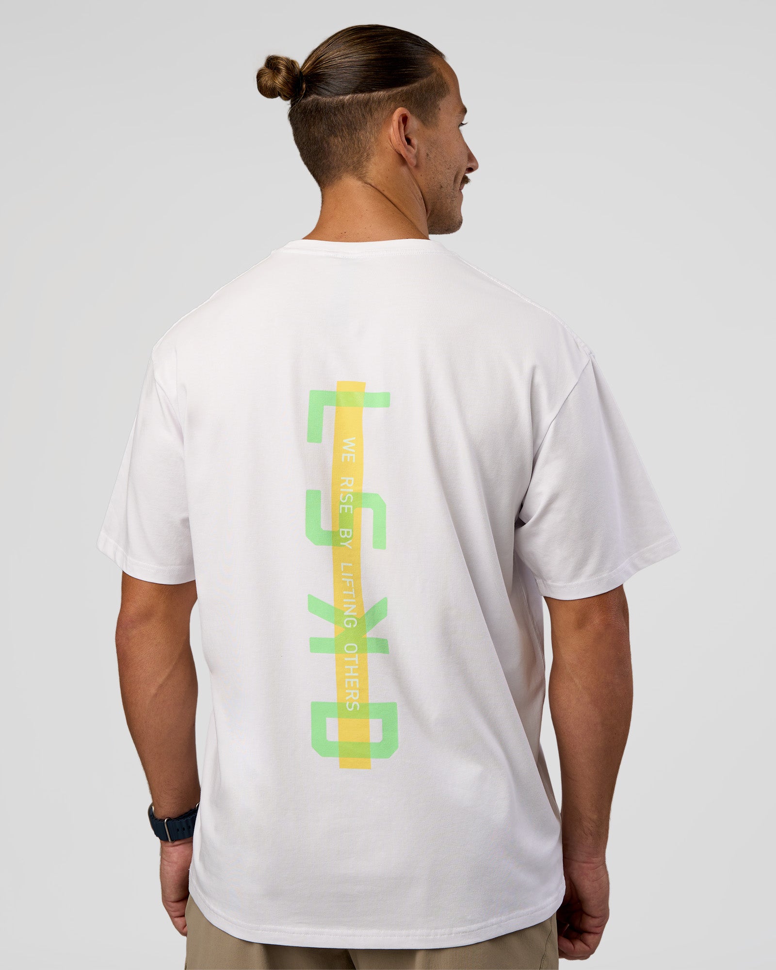 Man wearing Unisex Strike Through FLXCotton Tee Oversize - White-Warm Apricot | Model:Jaiden | Size:L