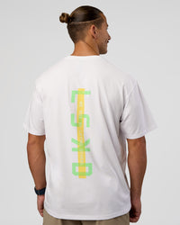 Man wearing Unisex Strike Through FLXCotton Tee Oversize - White-Warm Apricot | Model:Jaiden | Size:L