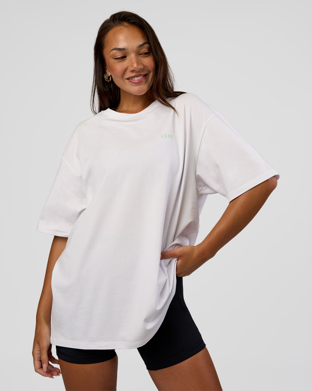 Woman wearing Unisex Strike Through FLXCotton Tee Oversize - White-Warm Apricot | Model:Kirstyn | Size:L