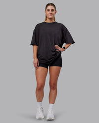 Woman wearing Unisex Washed RUN CLUB FLXCotton Tee Oversize - Black-Black