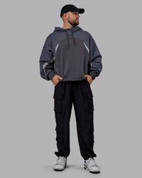 Man wearing Unisex Y2K Concept Panel Hoodie - Asphalt-Turbulance | Thumbnail Index: 7