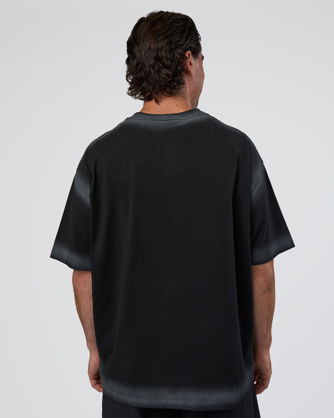 Man wearing Urban Blur Heavyweight Unisex Oversized Tee - Black-Dark Storm | Model:Adam | Size:L