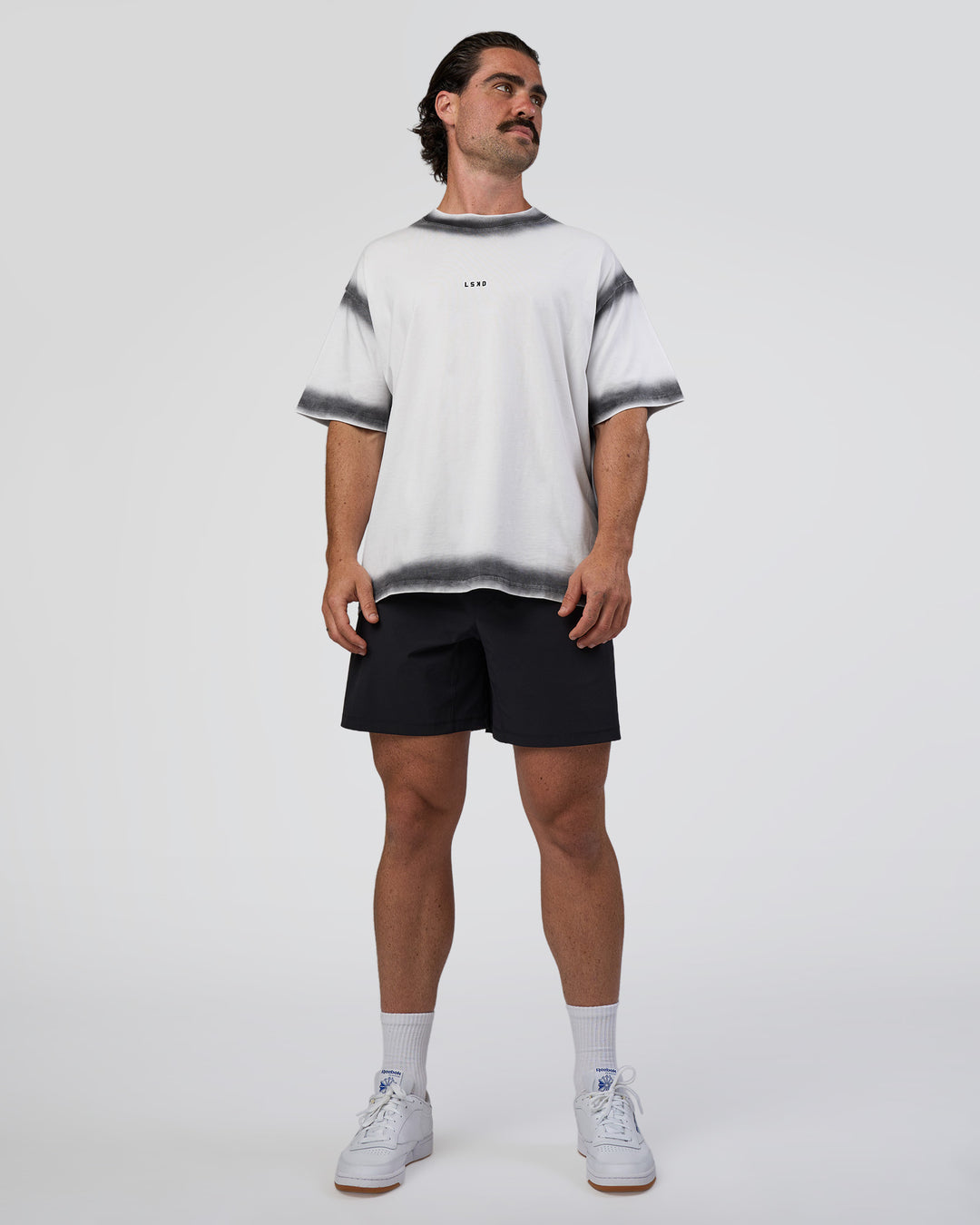 Man wearing Urban Blur Heavyweight Unisex Oversized Tee - White-Black | Model:Adam | Size:L
