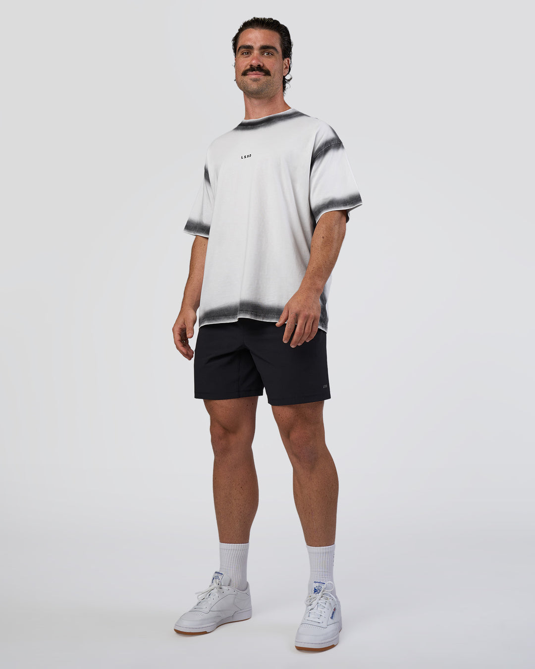 Man wearing Urban Blur Heavyweight Unisex Oversized Tee - White-Black | Model:Adam | Size:L