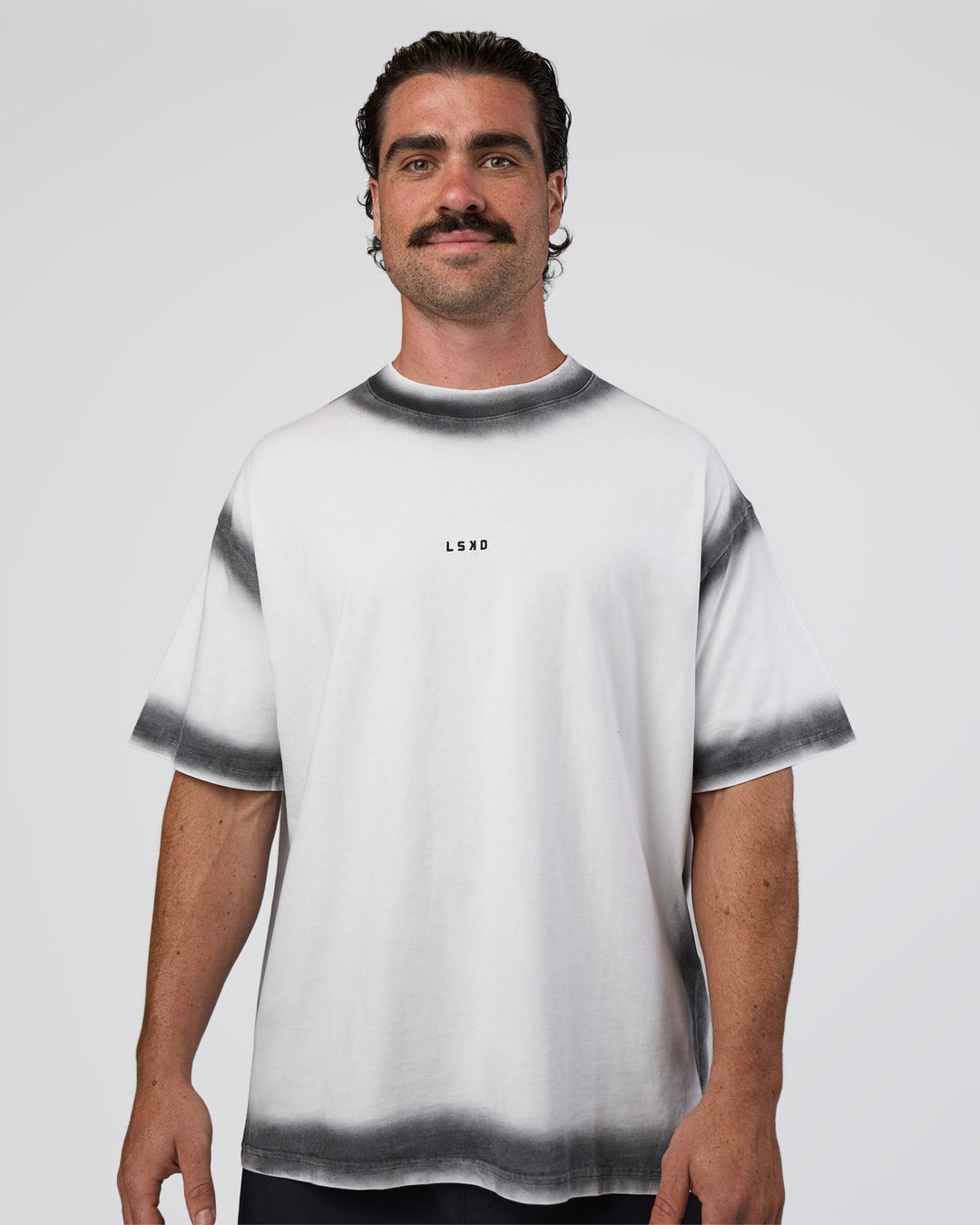 Man wearing Urban Blur Heavyweight Unisex Oversized Tee - White-Black | Model:Adam | Size:L