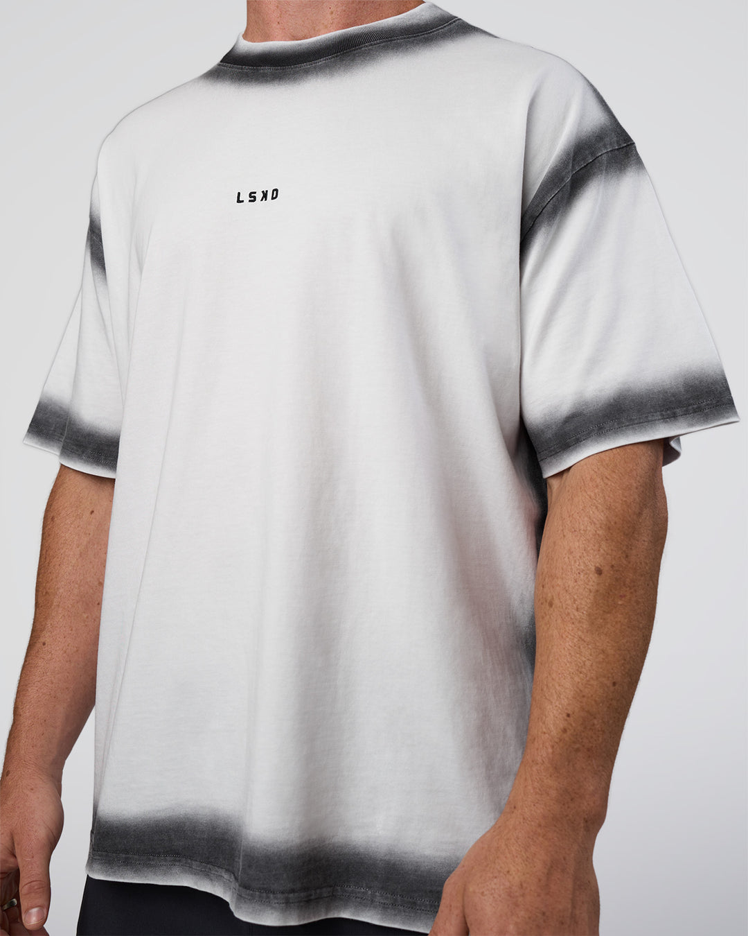 Man wearing Urban Blur Heavyweight Unisex Oversized Tee - White-Black | Model:Adam | Size:L