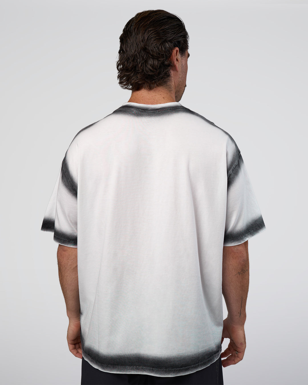 Man wearing Urban Blur Heavyweight Unisex Oversized Tee - White-Black | Model:Adam | Size:L