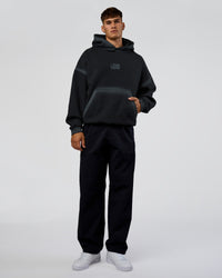 Man wearing Urban Blur Unisex Oversized Hoodie - Black-Dark Storm | Model:Jackson | Size:L