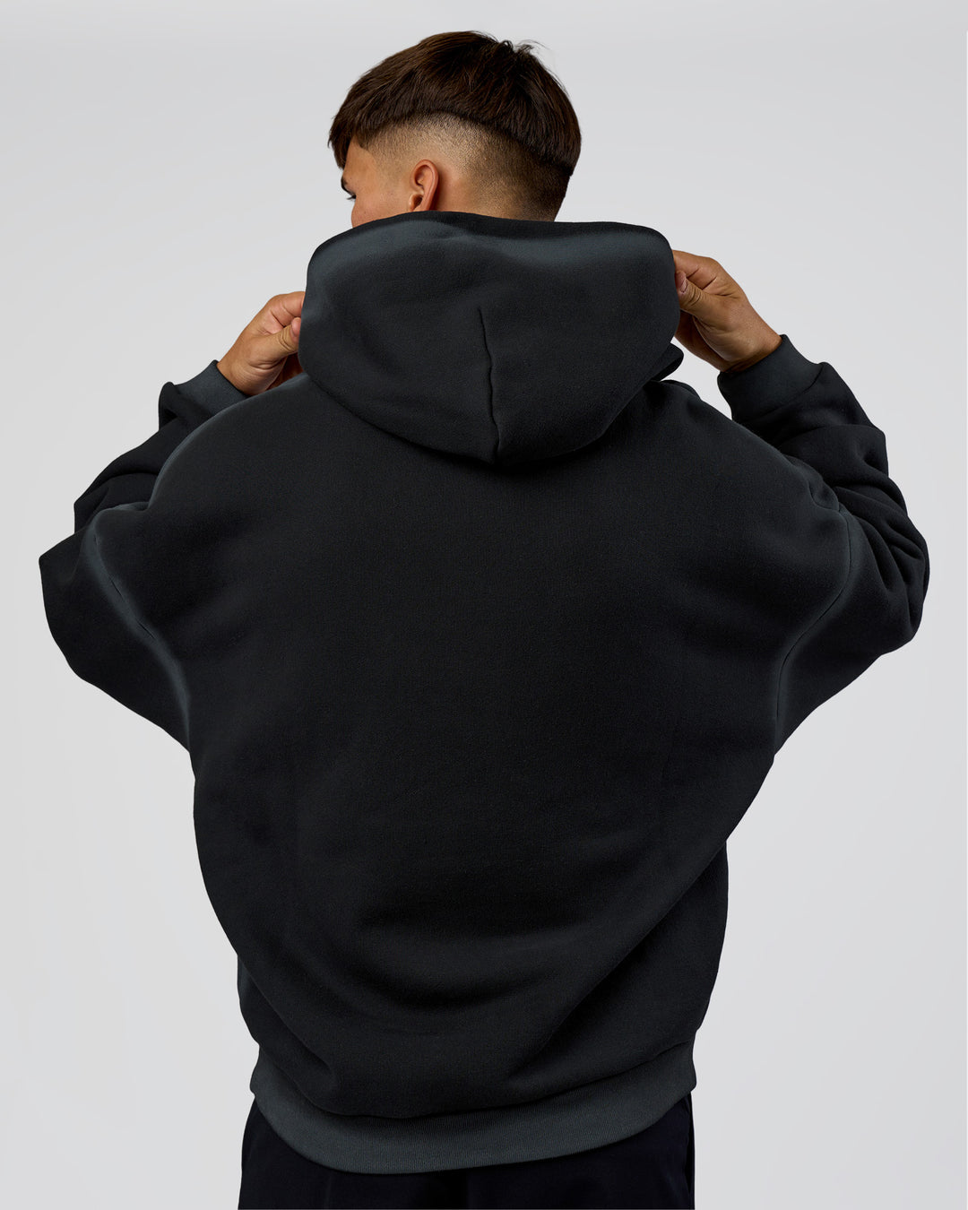Man wearing Urban Blur Unisex Oversized Hoodie - Black-Dark Storm | Model:Jackson | Size:L
