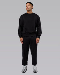 Man wearing Urban Cropped Track Pant - Black| Model:Kaelyb | Size:L
