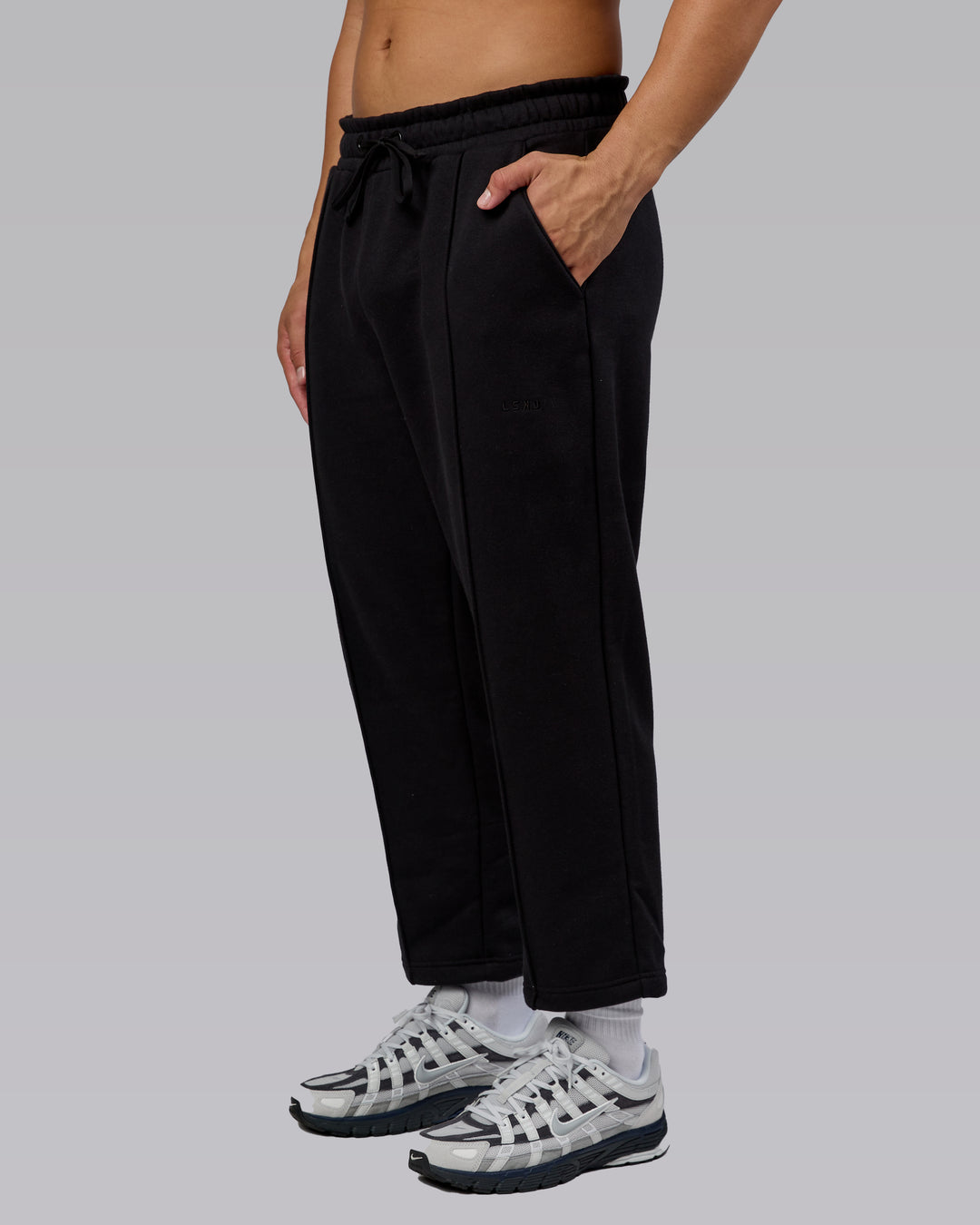 Man wearing Urban Cropped Track Pant - Black| Model:Kaelyb | Size:L
