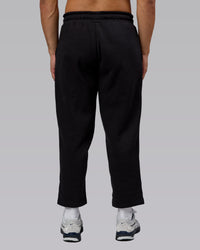 Man wearing Urban Cropped Track Pant - Black| Model:Kaelyb | Size:L