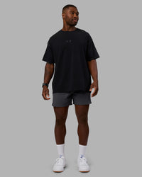 Man wearing Variation Heavyweight FLXCotton Oversized Tee - Black-Black | Model:Sam | Size:L