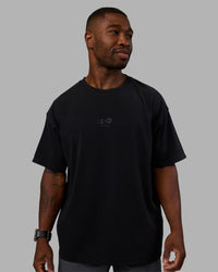  Man wearing Variation Heavyweight FLXCotton Oversized Tee - Black-Black | Model:Sam | Size:L