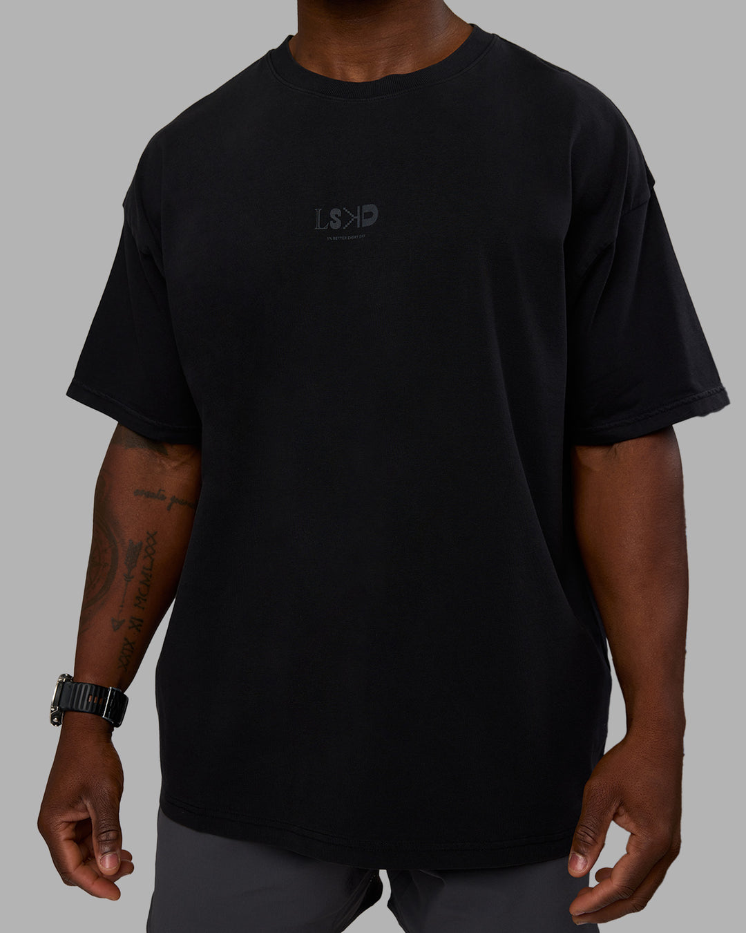 Man wearing Variation Heavyweight FLXCotton Oversized Tee - Black-Black | Model:Sam | Size:L